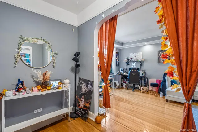 a view of a hallway with lots of different colored cloths