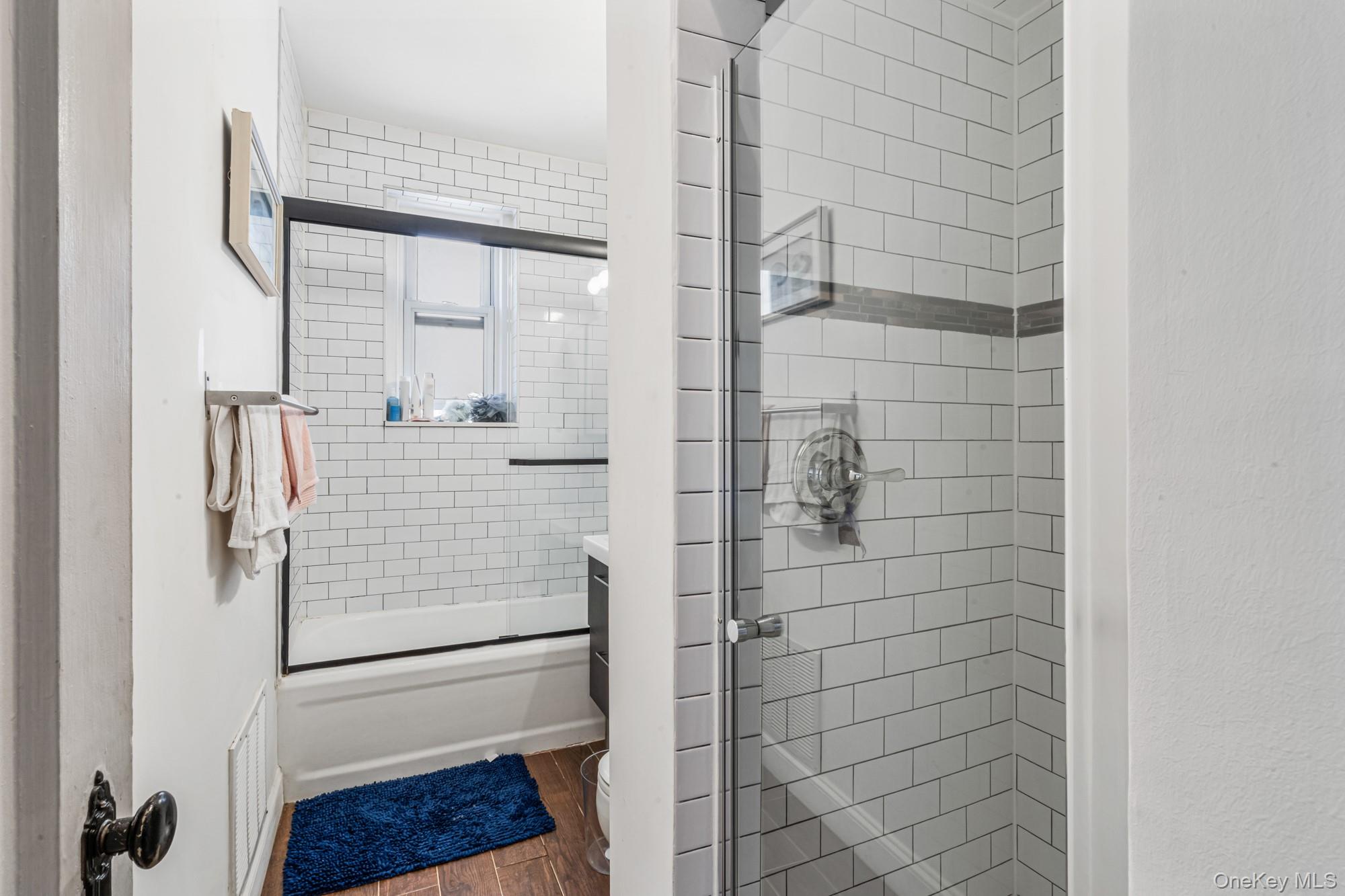 45 Kew Gardens Road, Unit 4A Queens, NY 11415 - Photo 6 of 19 a bathroom with a shower