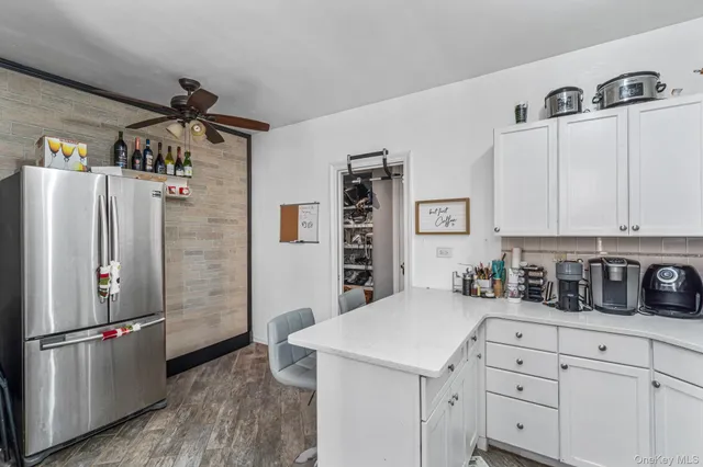 a bedroom that has a bed and a chandelier