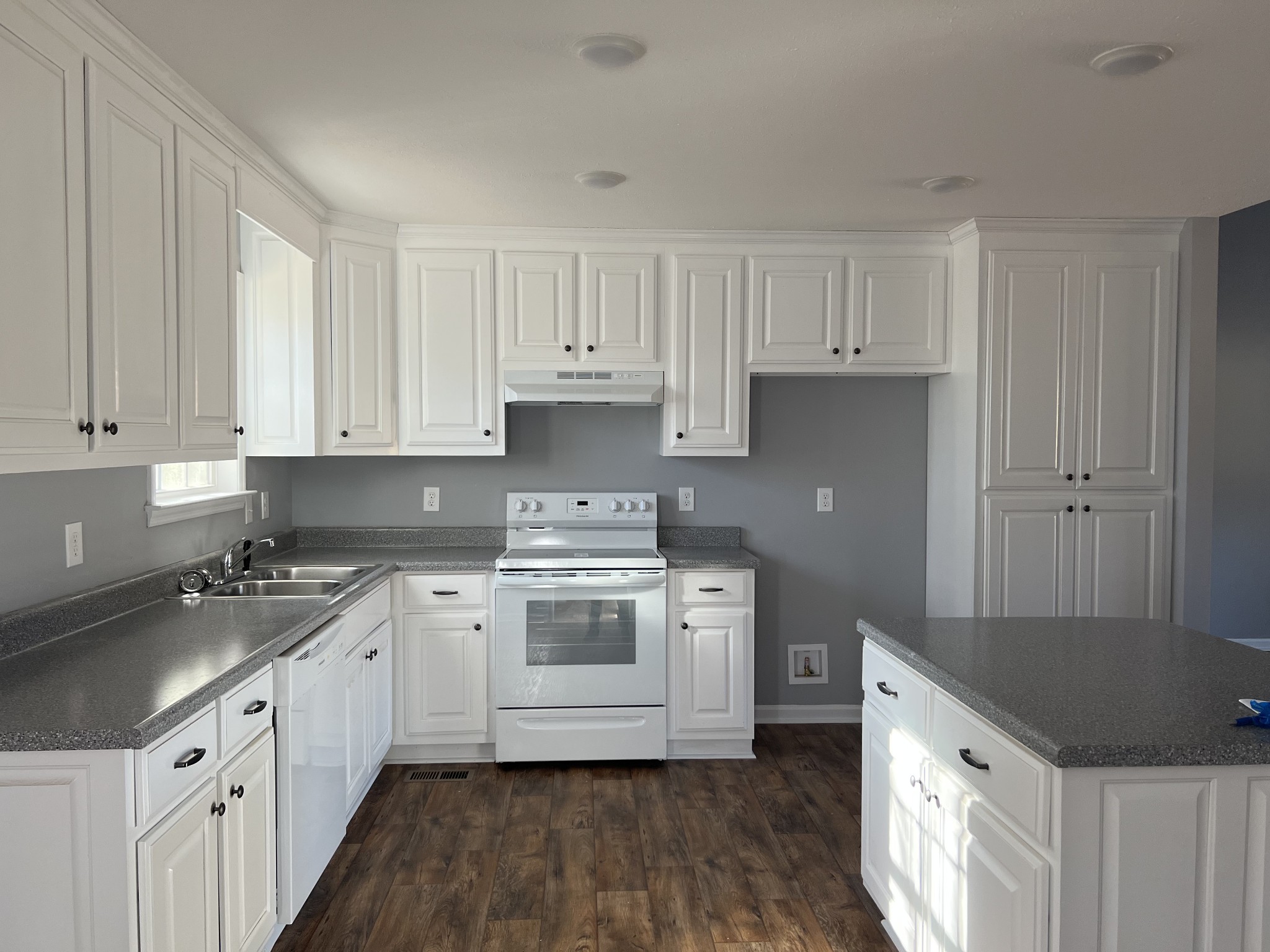 2379 Franklin Hayes Road Pulaski, TN 38478 - Photo 6 of 19 a kitchen with a sink stove and cabinets
