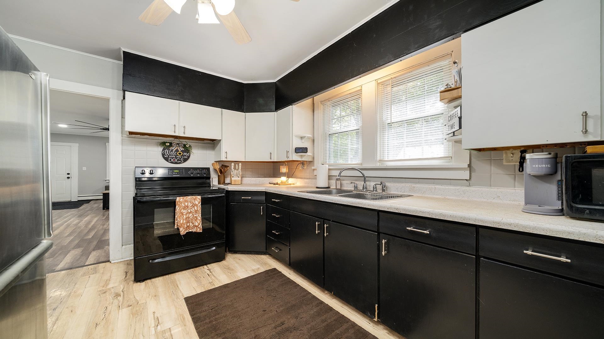 708 West Washington Street Oregon, IL 61061 - Photo 11 of 26 a kitchen with granite countertop a stove a sink and a cabinets