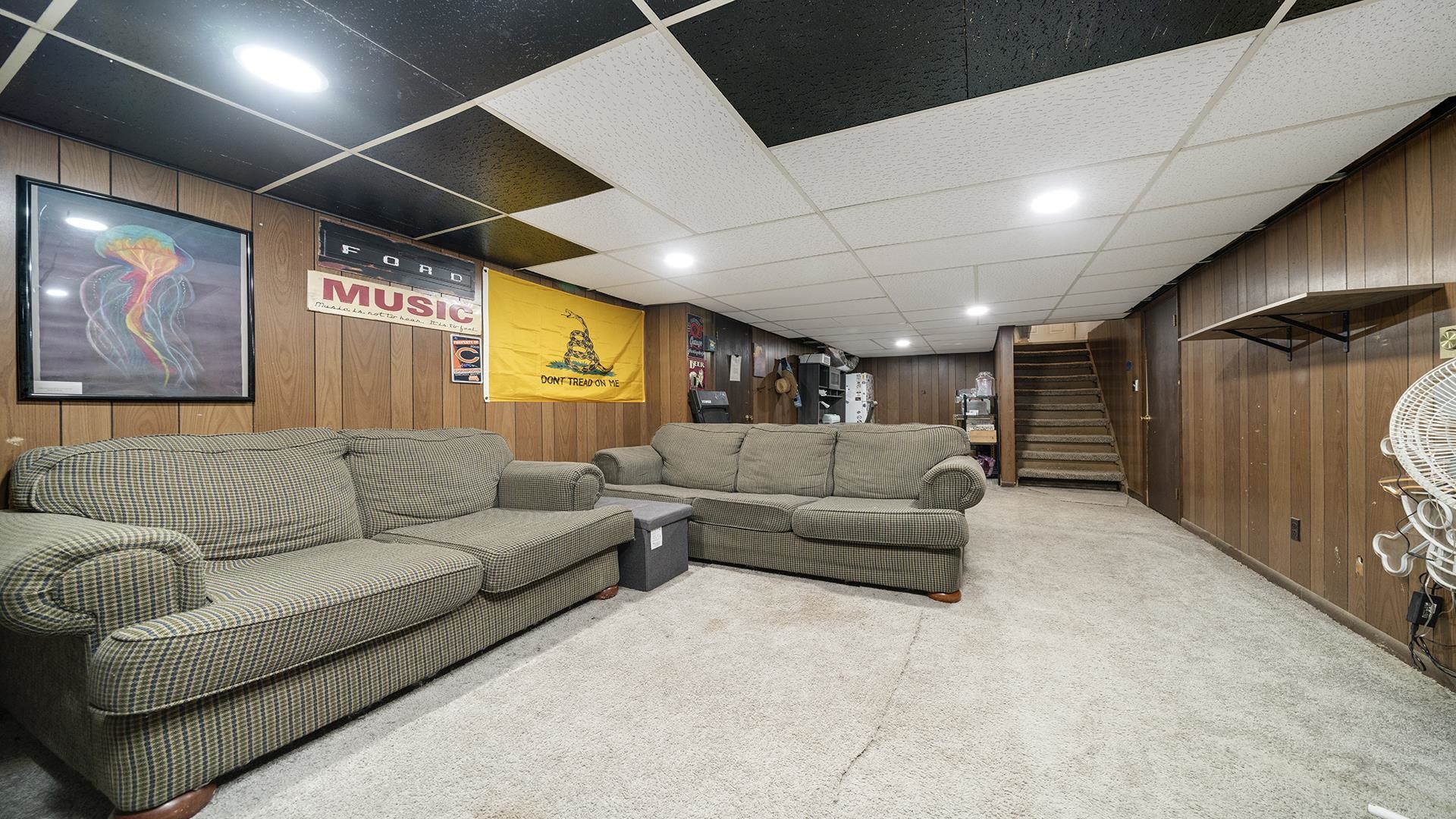 708 West Washington Street Oregon, IL 61061 - Photo 17 of 26 a living room with furniture and a large window