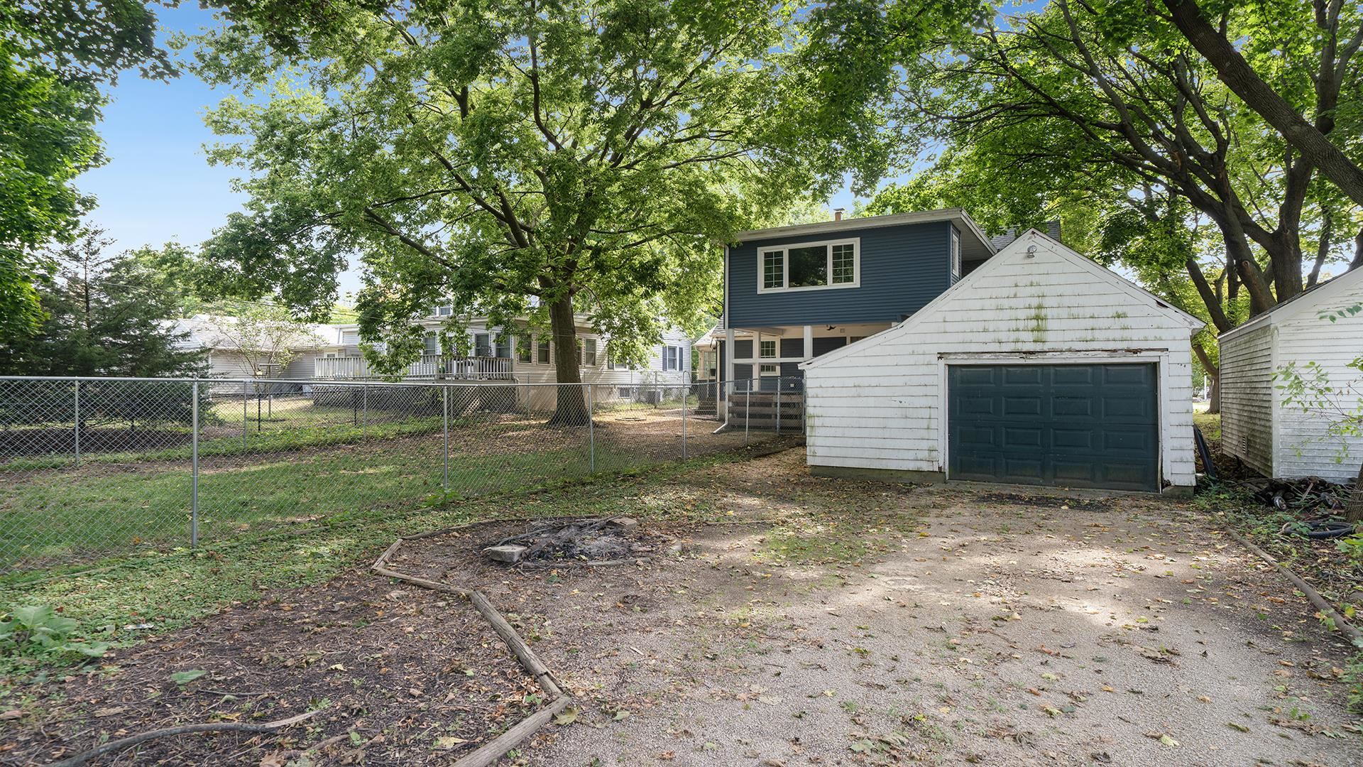 708 West Washington Street Oregon, IL 61061 - Photo 21 of 26 a front view of a house with a yard and garage