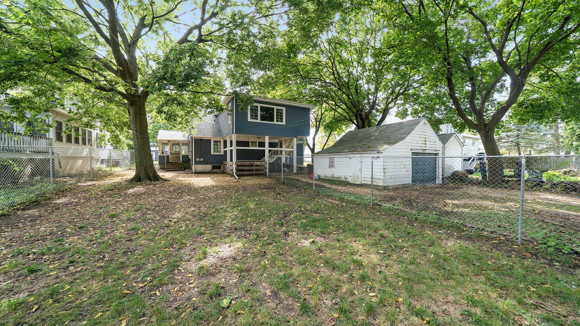 708 West Washington Street Oregon, IL 61061 - Photo 23 of 26 a view of a house with backyard and a tree