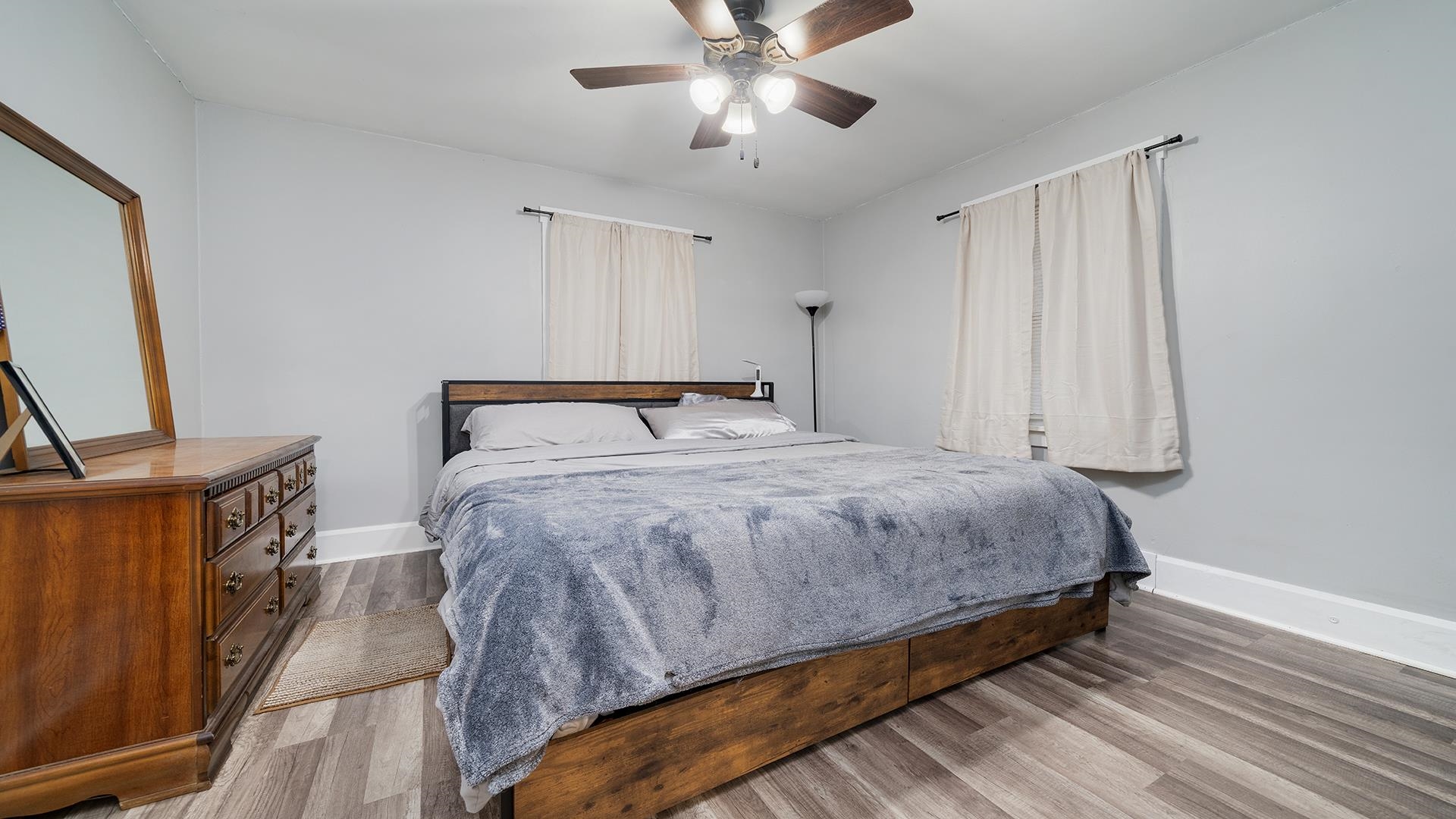 708 West Washington Street Oregon, IL 61061 - Photo 6 of 26 a bedroom with a bed and a flat tv screen on dresser