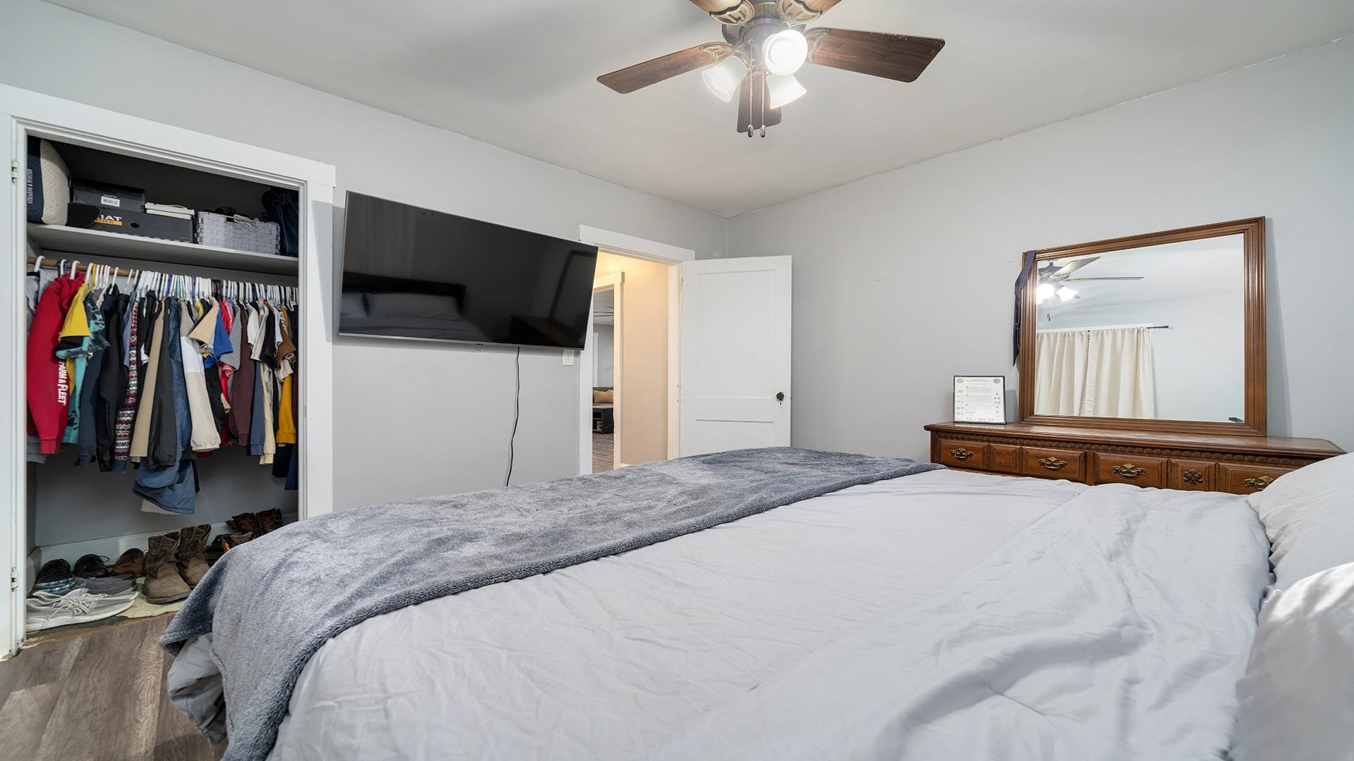 708 West Washington Street Oregon, IL 61061 - Photo 7 of 26 a bedroom with a bed and a flat screen tv