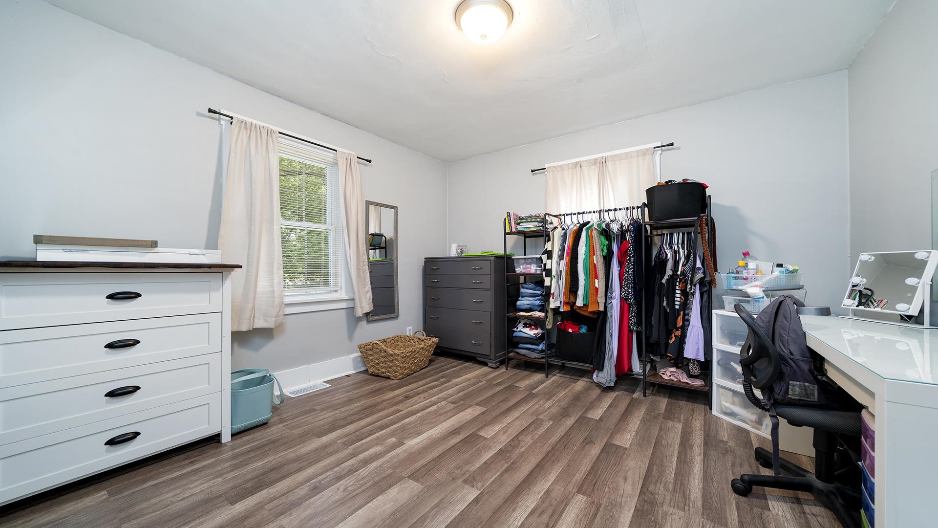 708 West Washington Street Oregon, IL 61061 - Photo 8 of 26 a view of walk in closet with clothes and shoes