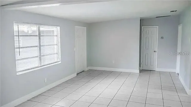 an empty room with windows