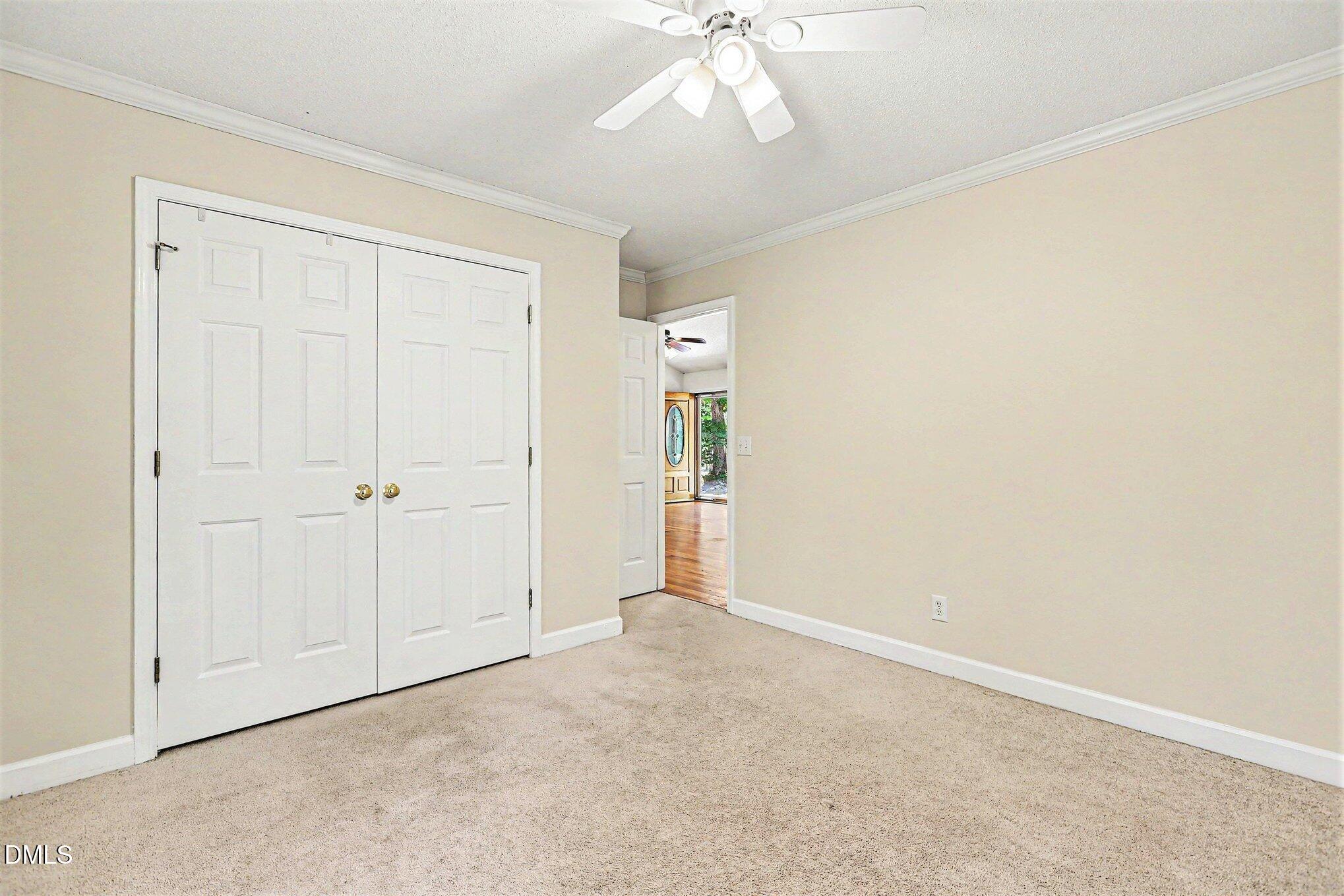 5359 Bass Mountain Road Snow Camp, NC 27349 - Photo 15 of 25 an empty room with a ceiling fan