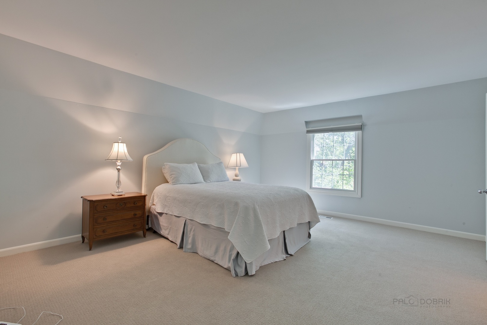 13 Forest Hills Road Lake Bluff, IL 60044 - Photo 16 of 24 a spacious bedroom with a bed and a window