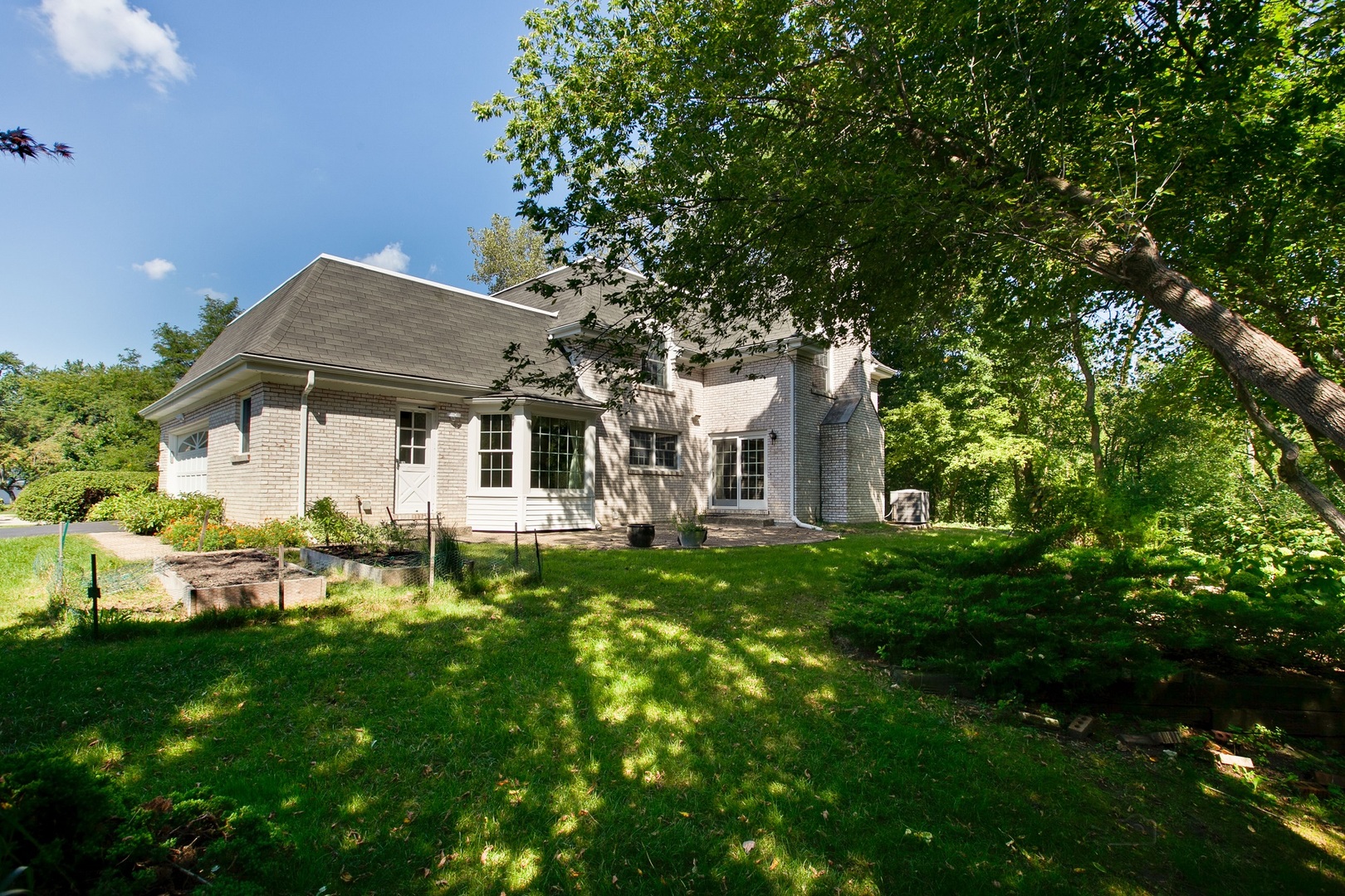 13 Forest Hills Road Lake Bluff, IL 60044 - Photo 23 of 24 a front view of a house with a yard
