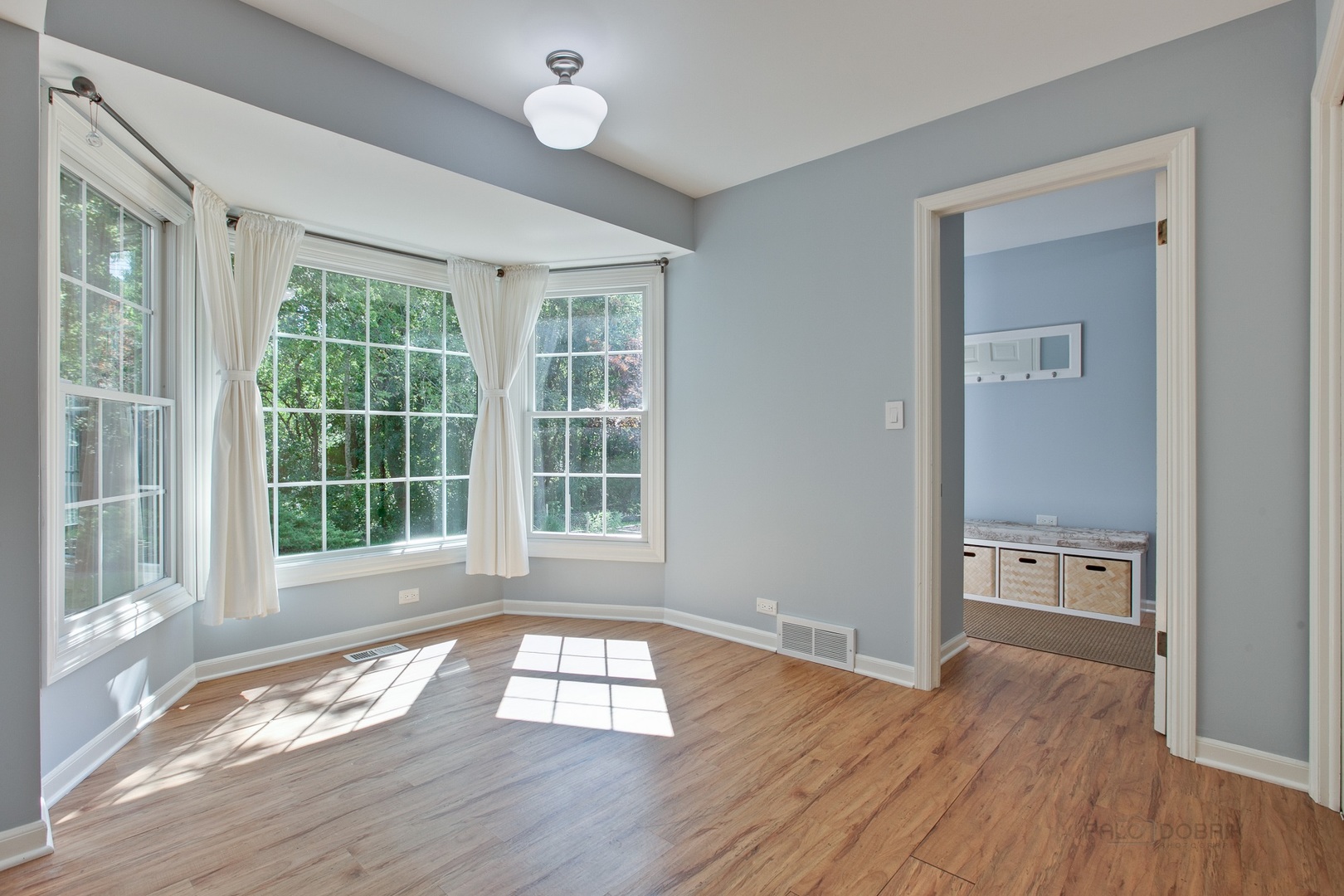 13 Forest Hills Road Lake Bluff, IL 60044 - Photo 9 of 24 an empty room with wooden floor and windows