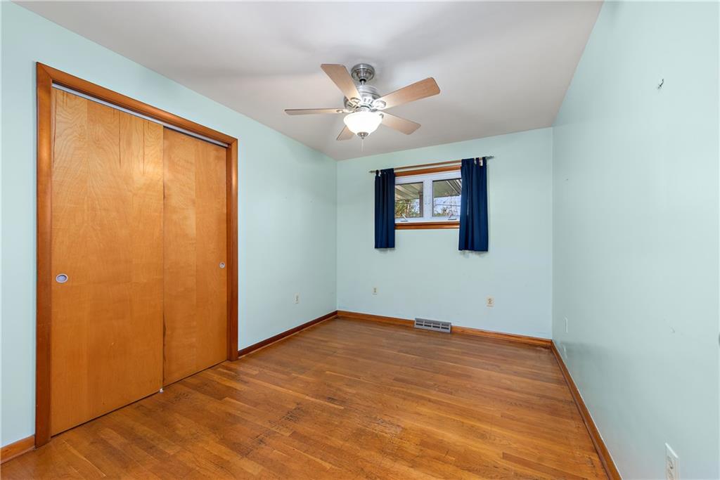 604 Davidson Drive Rochester, PA 15074 - Photo 18 of 25 an empty room with a window and ceiling fan
