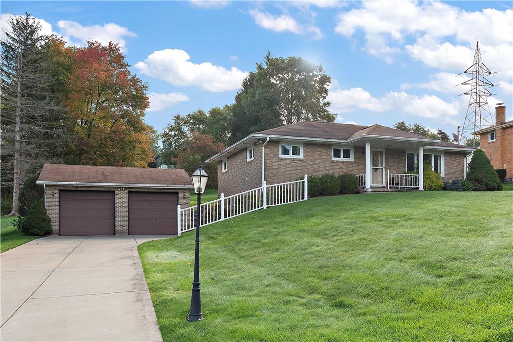 604 Davidson Drive Rochester, PA 15074 - Photo 4 of 25 a view of a house with a yard and a garden