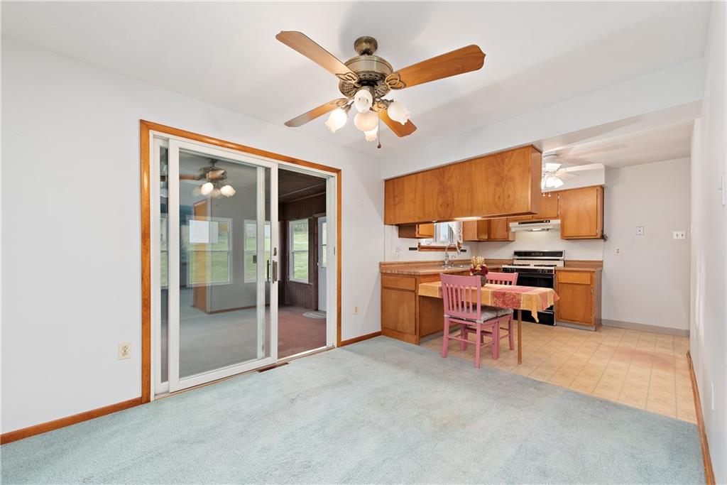 604 Davidson Drive Rochester, PA 15074 - Photo 9 of 25 a view of a livingroom with workspace and a ceiling fan