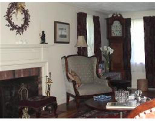 236 Follen Road Lexington, MA 02421 - Photo 3 of 9 a living room with furniture and a fireplace