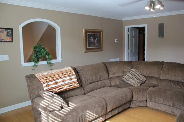 a room with furniture and wall paintings