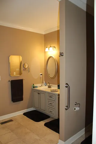 a terrace of a house with yard and mountain view in back