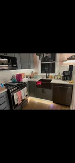 a kitchen with a stove and a microwave