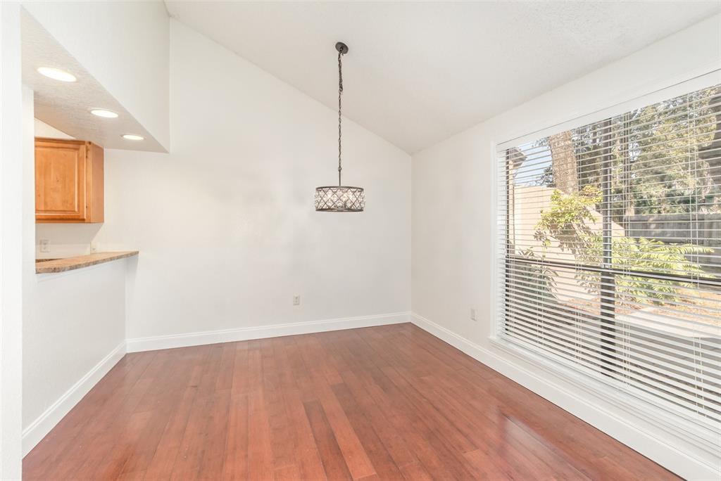 940 Douglas Avenue, Unit 175 Altamonte Springs, FL 32714 - Photo 11 of 44 a view of a room with wooden floor and white walls
