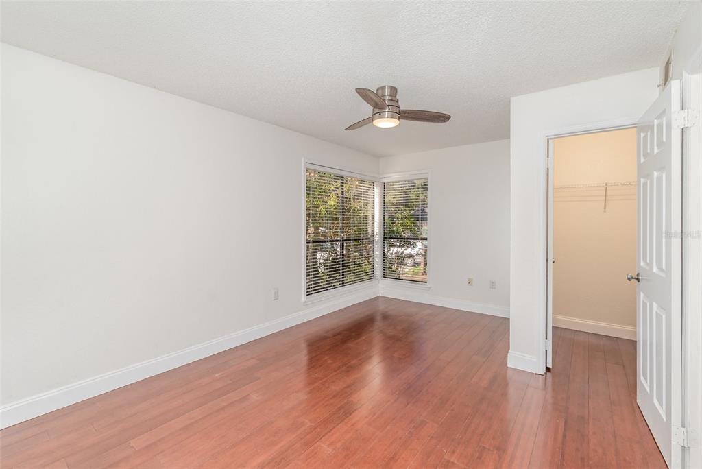 940 Douglas Avenue, Unit 175 Altamonte Springs, FL 32714 - Photo 15 of 44 a view of empty room with wooden floor and fan