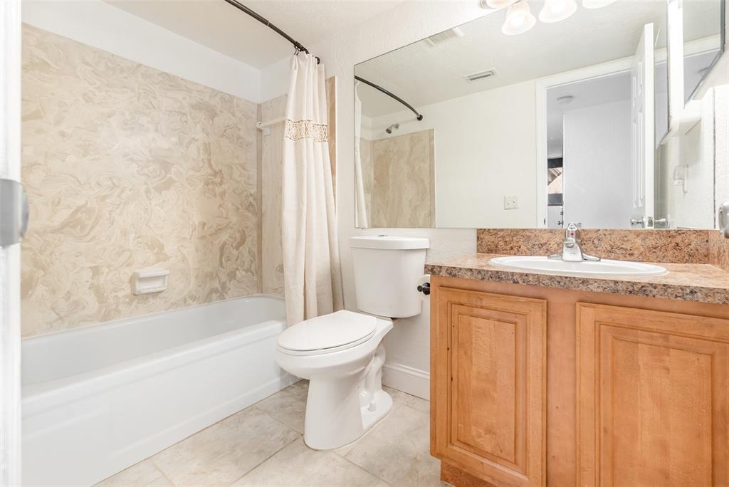 940 Douglas Avenue, Unit 175 Altamonte Springs, FL 32714 - Photo 18 of 44 a bathroom with a granite countertop sink toilet and shower