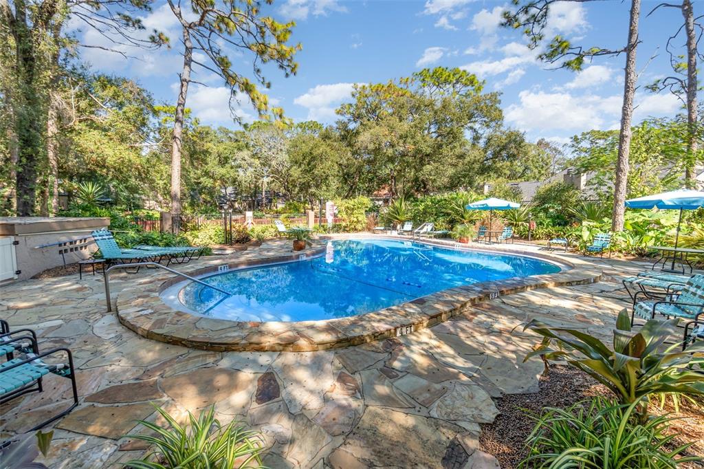 940 Douglas Avenue, Unit 175 Altamonte Springs, FL 32714 - Photo 37 of 44 a view of a swimming pool with an outdoor space and seating area