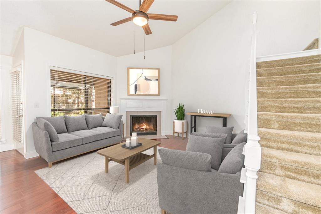 940 Douglas Avenue, Unit 175 Altamonte Springs, FL 32714 - Photo 8 of 44 a living room with furniture and a fireplace