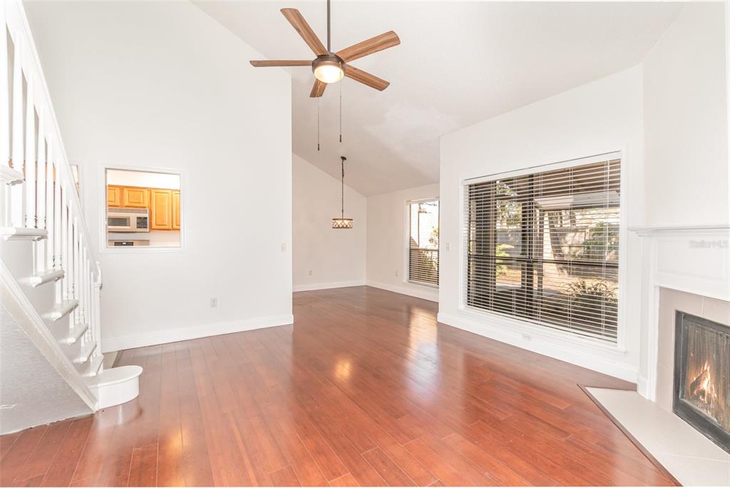 940 Douglas Avenue, Unit 175 Altamonte Springs, FL 32714 - Photo 10 of 44 a view of an empty room with wooden floor and a window
