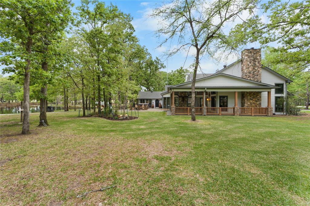 692 Private Road 5937 Emory, TX 75440 - Photo 34 of 40 a front view of a house with a garden