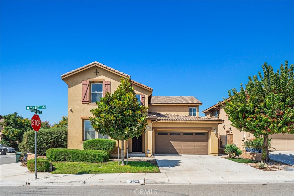8022-8022 Sea Salt Avenue Fontana, CA 92336 - Photo 1 of 35 a front view of a house with a yard