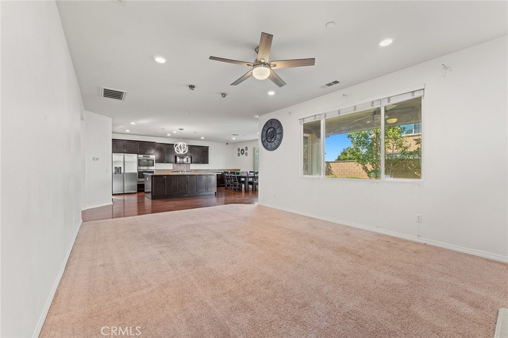 8022-8022 Sea Salt Avenue Fontana, CA 92336 - Photo 16 of 35 an empty room with kitchen and windows