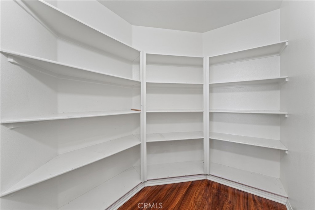 8022-8022 Sea Salt Avenue Fontana, CA 92336 - Photo 20 of 35 a view of walk in closet with empty racks
