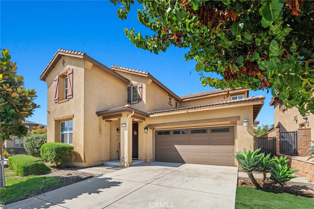 8022-8022 Sea Salt Avenue Fontana, CA 92336 - Photo 2 of 35 a front view of a house with garden
