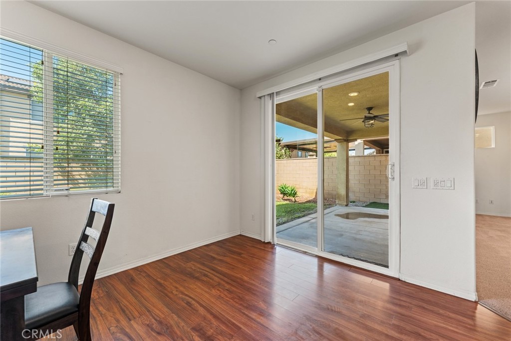 8022-8022 Sea Salt Avenue Fontana, CA 92336 - Photo 21 of 35 a room with wooden floor and windows