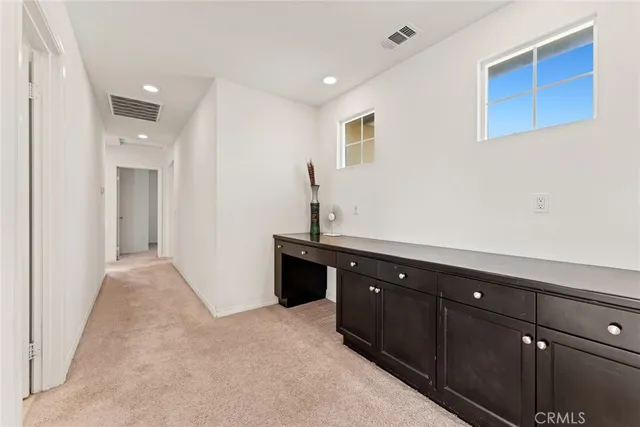 a room with a sink and cabinets