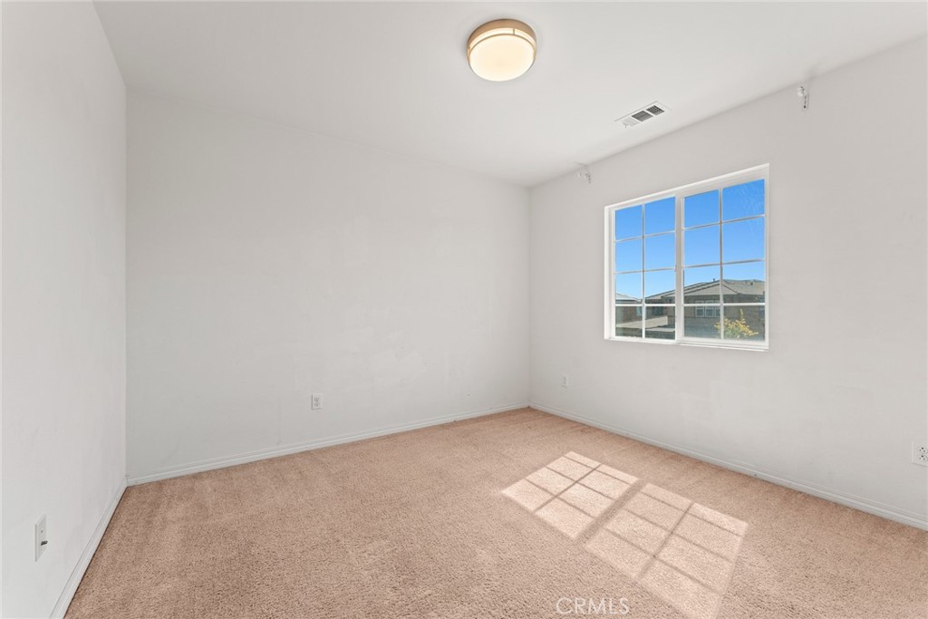 8022-8022 Sea Salt Avenue Fontana, CA 92336 - Photo 29 of 35 a view of an empty room with a window