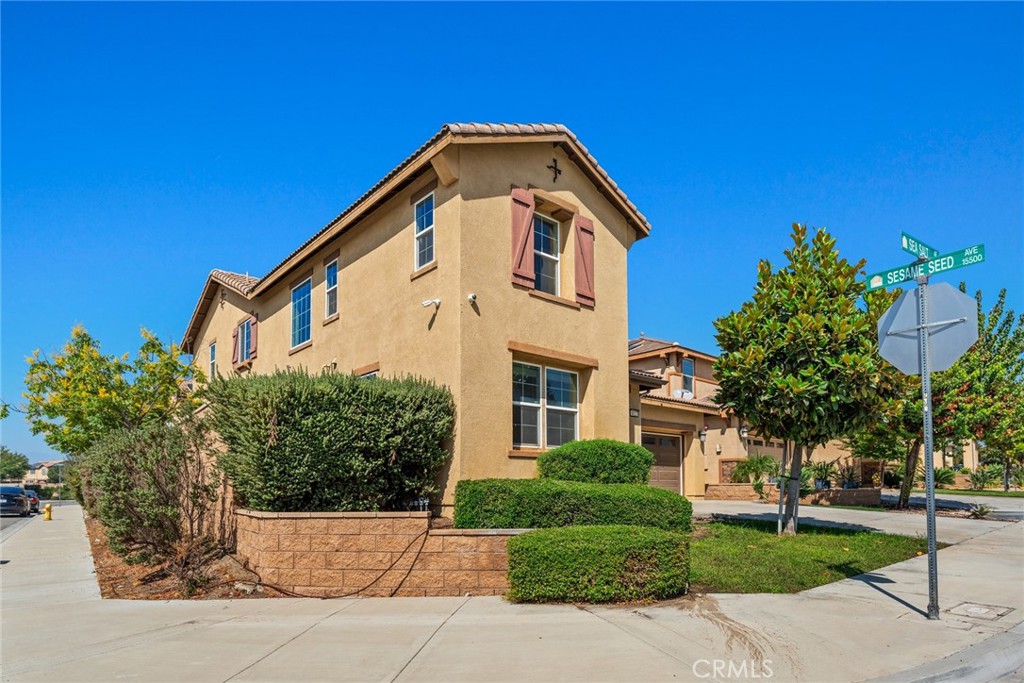 8022-8022 Sea Salt Avenue Fontana, CA 92336 - Photo 3 of 35 a front view of a house with a yard