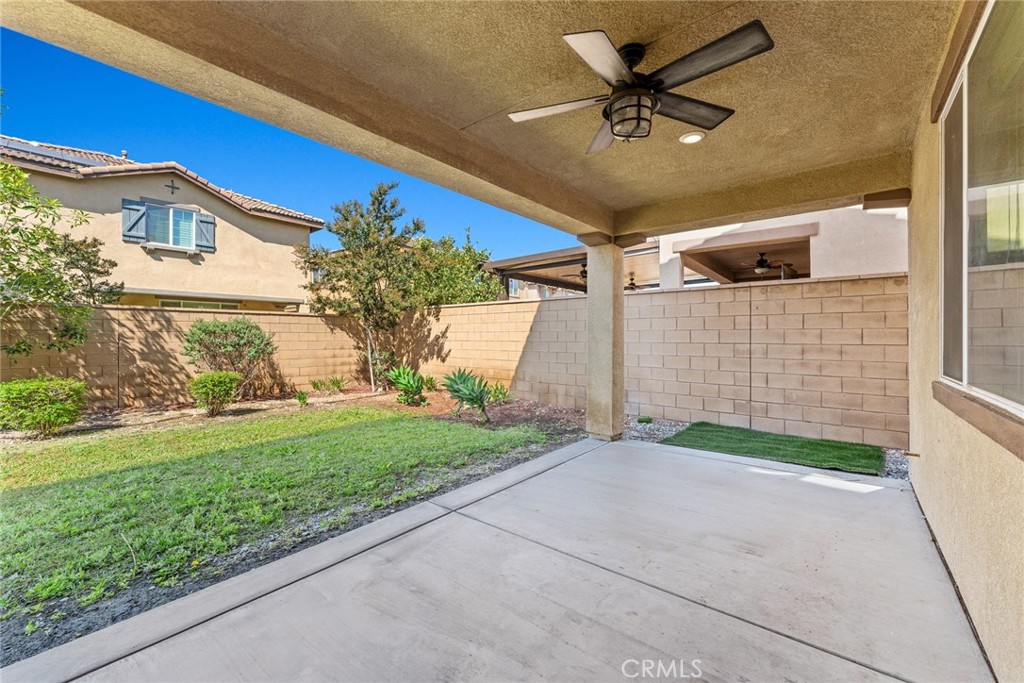 8022-8022 Sea Salt Avenue Fontana, CA 92336 - Photo 32 of 35 a view of a house with a yard and potted plants