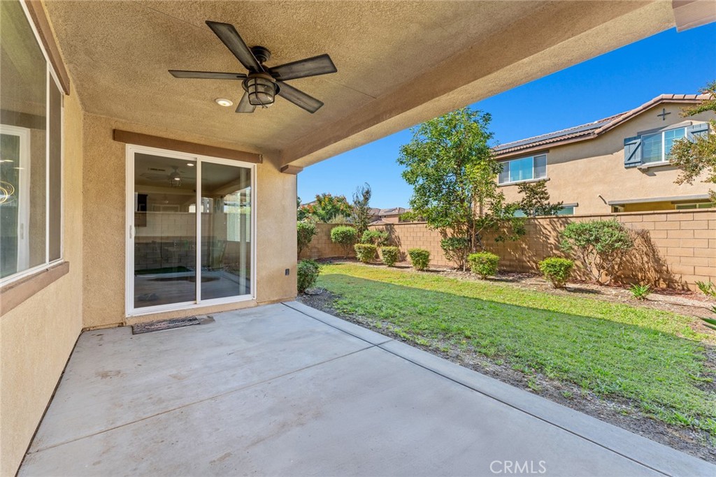 8022-8022 Sea Salt Avenue Fontana, CA 92336 - Photo 33 of 35 a view of a house with backyard and a garden