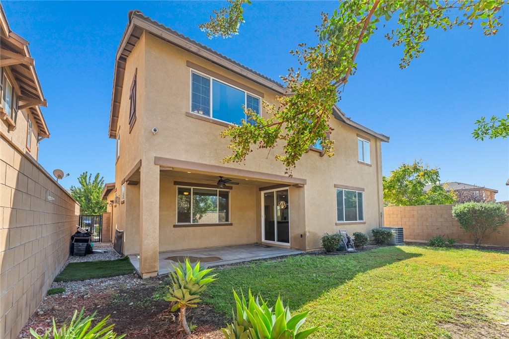 8022-8022 Sea Salt Avenue Fontana, CA 92336 - Photo 34 of 35 a front view of a house with a yard