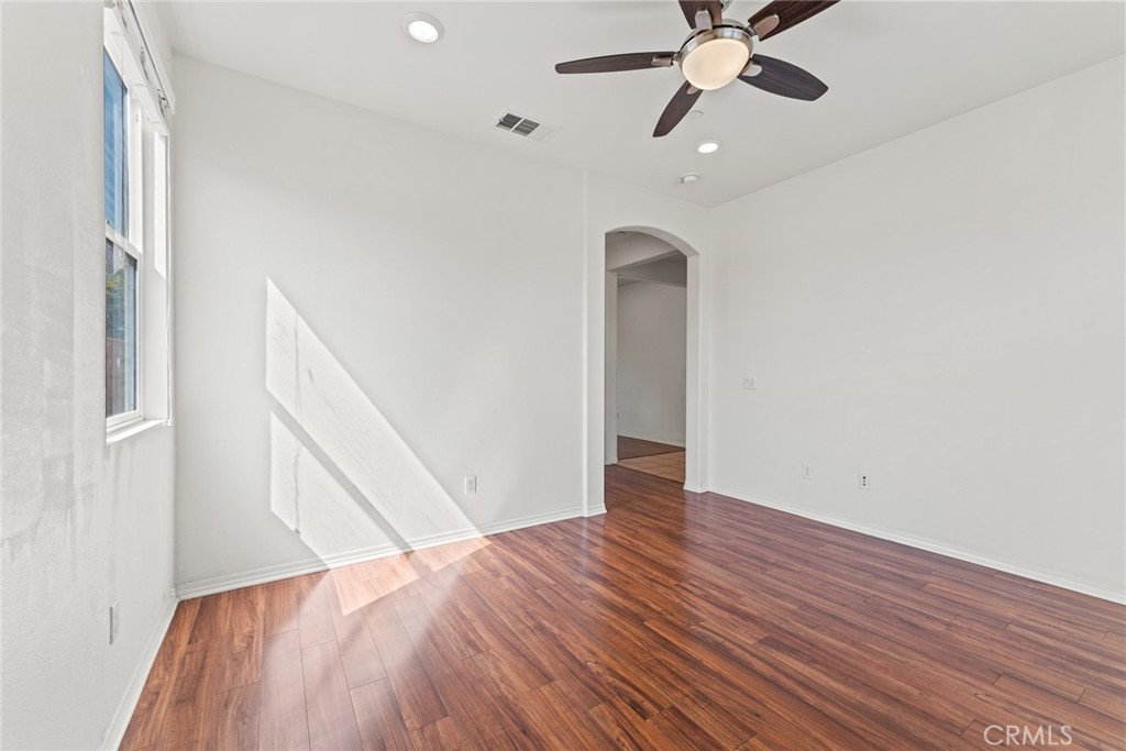 8022-8022 Sea Salt Avenue Fontana, CA 92336 - Photo 8 of 35 a view of empty room with wooden floor
