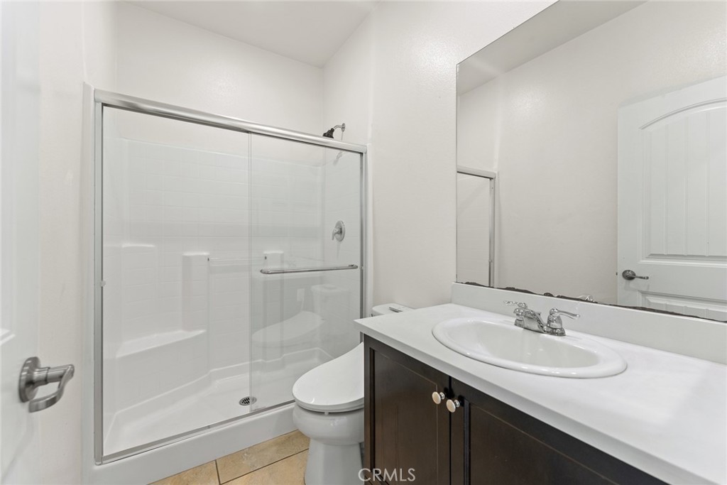 8022-8022 Sea Salt Avenue Fontana, CA 92336 - Photo 9 of 35 a bathroom with a sink toilet and shower