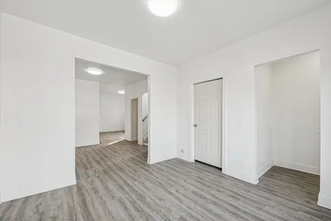 a view of a livingroom with wooden floor
