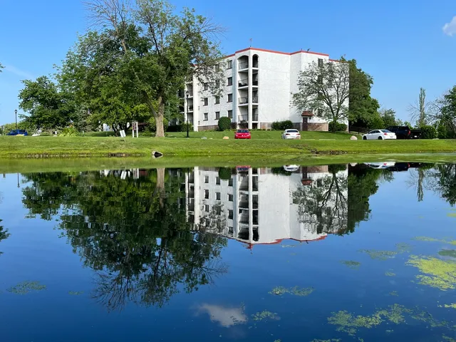a view of a golf course with a lake view