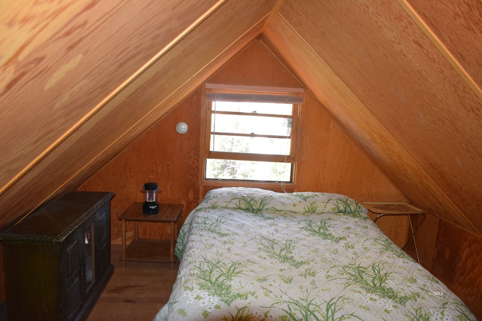 4 Whitney Portal Road Lone Pine, CA 93545 - Photo 14 of 20 a bed sitting in a bedroom next to a window