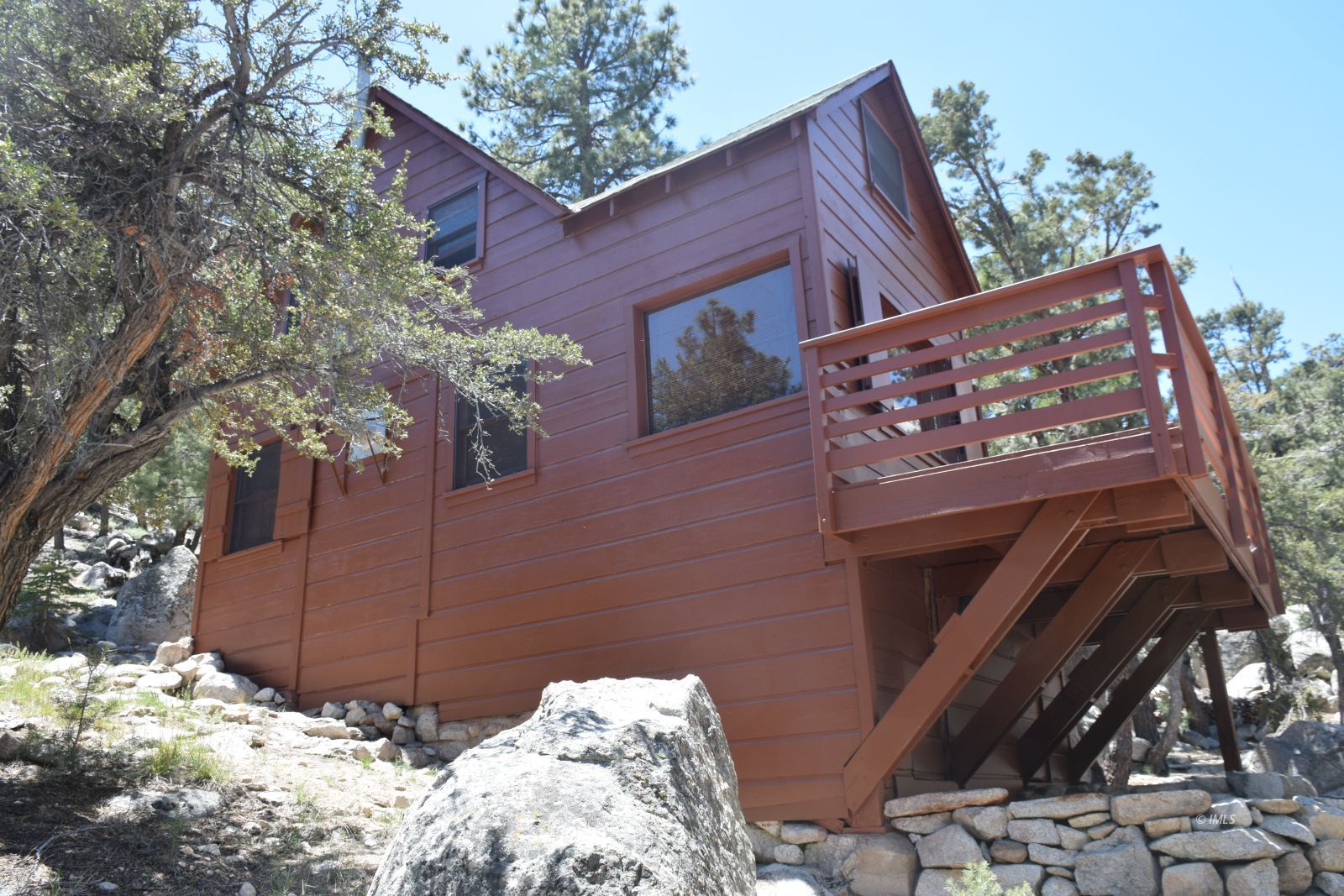 4 Whitney Portal Road Lone Pine, CA 93545 - Photo 19 of 20 a brick building with a large tree in the background