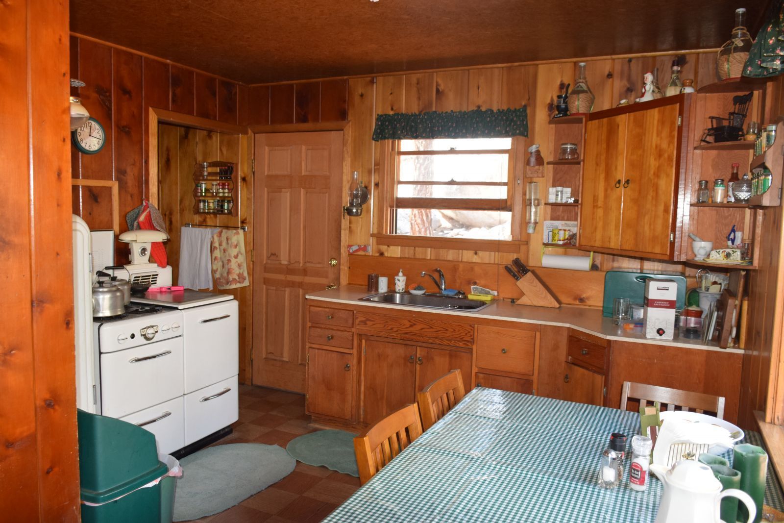 4 Whitney Portal Road Lone Pine, CA 93545 - Photo 10 of 20 a kitchen with stainless steel appliances wooden floor and cabinets