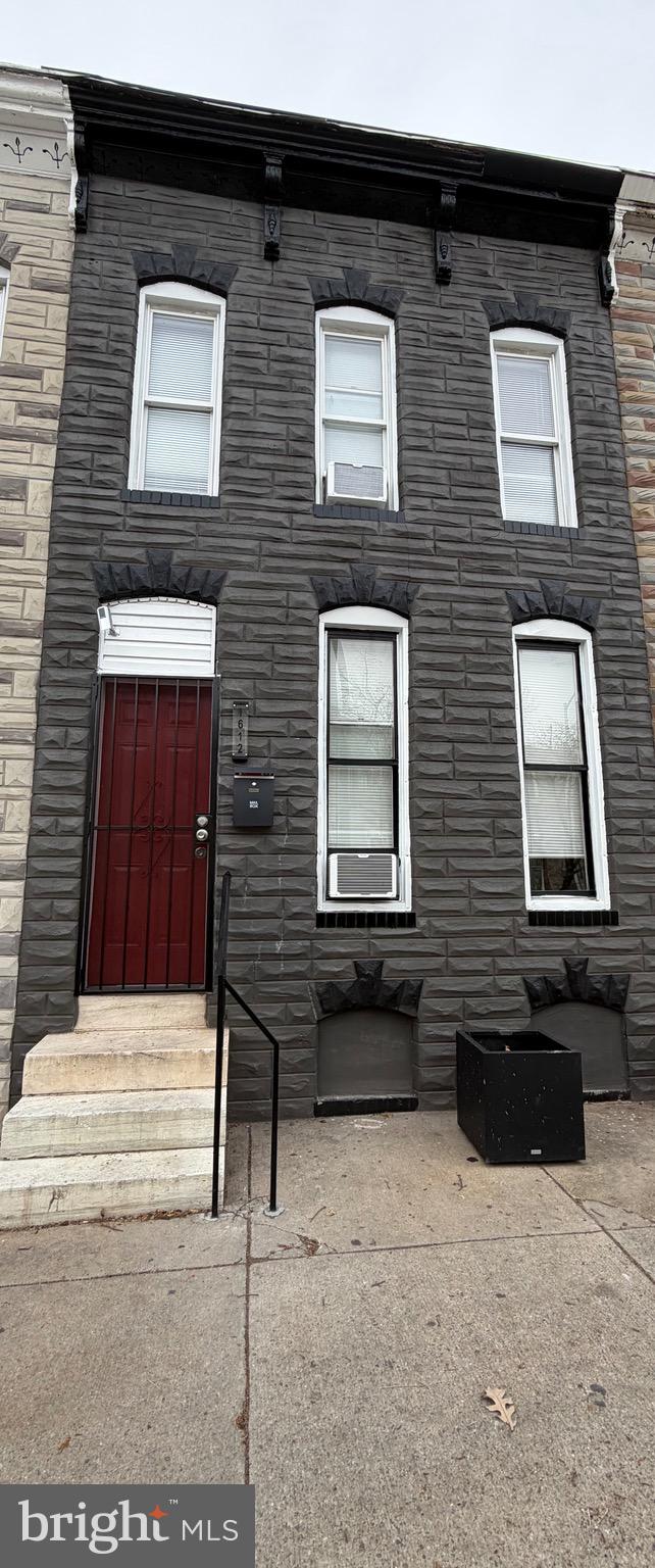 a backyard of a house with sofas