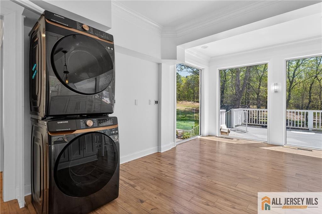 381 Monmouth Road Freehold, NJ 07728 - Photo 20 of 63 a view of a bedroom with washer and dryer